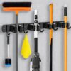 JIALTO Broom Holder and Mop Organizer | Mop Holder For Wall Without Drilling with 4 Slots and 5 Hooks for Kitchen, Garage, Garden, and Utility | Space Saving Cleaning Tool Organizer (Black)