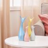Amazon Basics Home Decor Happy Deer Family Action Statue Piano Finish Ceramic Figures(Set of 4,Multicolor)